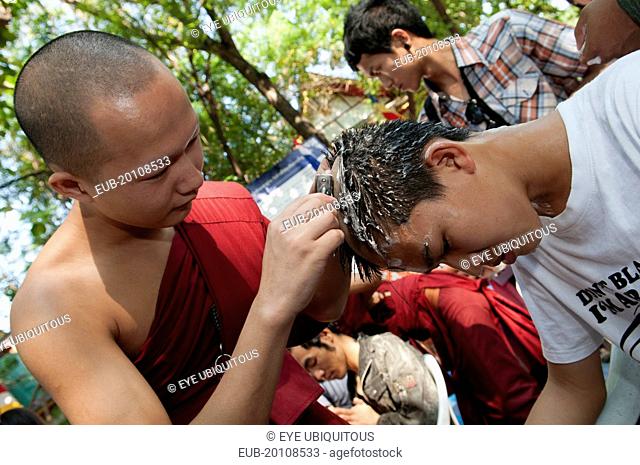 Shaving of hair is part of the ritual of Poi Sang Long. This is the ordination ceremony for Shan boys to become novice Buddhist monks in Thailand