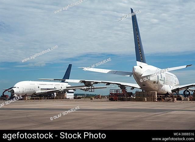 Singapore, Republic of Singapore, Asia - Two retired Singapore Airlines (SIA) Airbus A380 and one Boeing 777-200 are parked and ready to be scrapped at the...