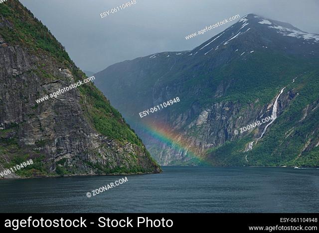 Beautiful rainbow over Geirangerfjord, located near the Geiranger village, Norway