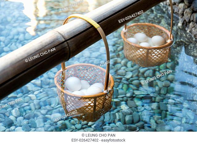 Japanese hot spring steam boil eggs inside basket