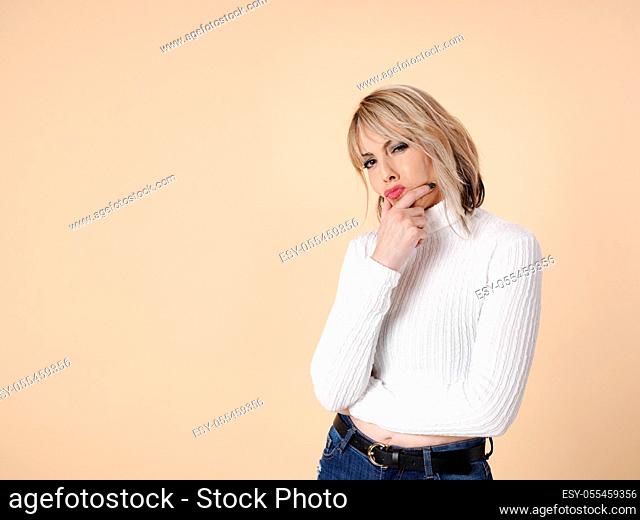 Young woman with doubtful gesture