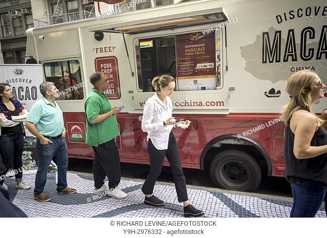 A food truck distributes samples of cuisine from Macao in New York on Tuesday, September 19, 2017 during a branding event for Macao Tourism