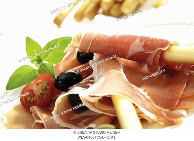 Grissini with parma ham and olives
