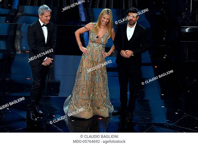Tv hosts Claudio Baglioni, Michelle Hunziker and Pierfrancesco Favino on the Ariston stage during the 68th Festival di Sanremo