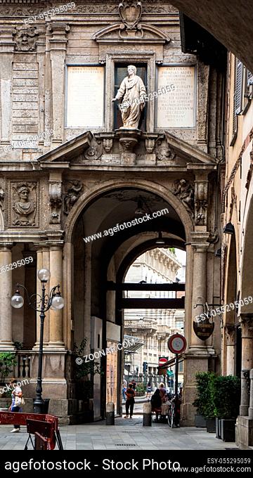 italy city trip milan gate through old stone building