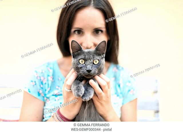 Woman holding Russian Blue