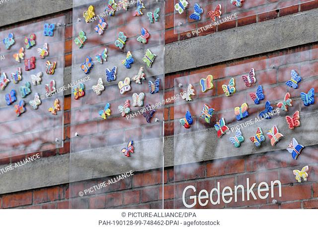 25 January 2019, Brandenburg, Cottbus: Ceramic butterflies can be seen on the façade of the ""Moving Primary School"" after the ceremonial inauguration of the...
