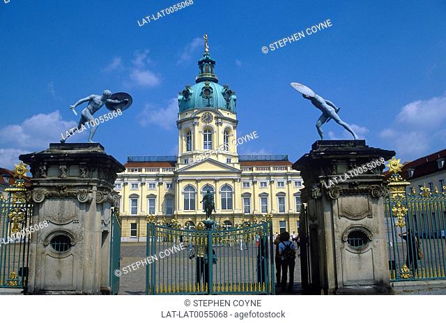 Schloss Charlottenburg. Summer palace. View from gate. Dome. Gladiator statues on posts. People