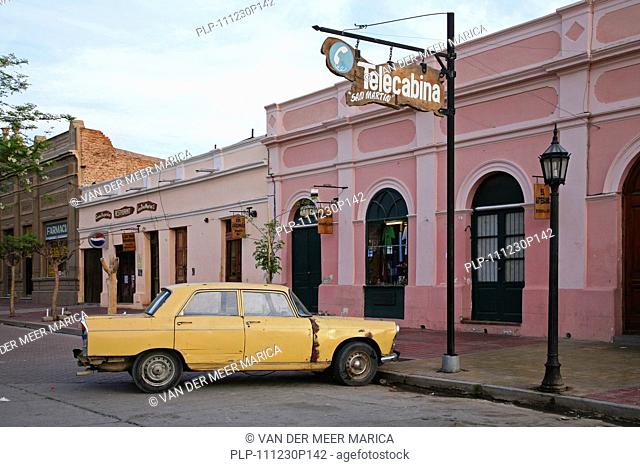 Yellow dilapidated car in Cafayate, Salta Province, Argentina