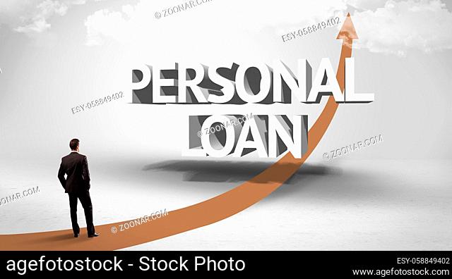 Rear view of a businessman standing in front of PERSONAL LOAN inscription, successful business concept