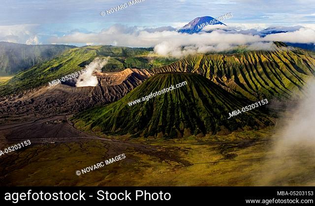 Active crater of Bromo on the left, volcano Batok in front and volcano Semeru behind, Bromo Tengger Semeru National Park, Java Island, Indonesia