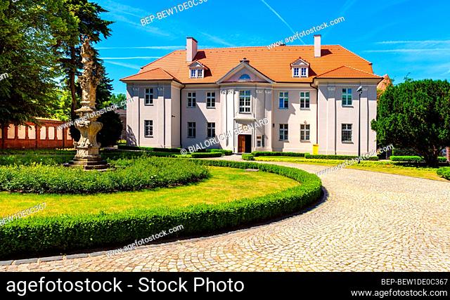 Poznan, Poland - June 5, 2015: Poznan Metropolitan Curia residence aside cathedral of St. Peter and St. Paul on historic Ostrow Tumski island at Cybina river