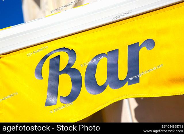 Bar sign board on yellow background