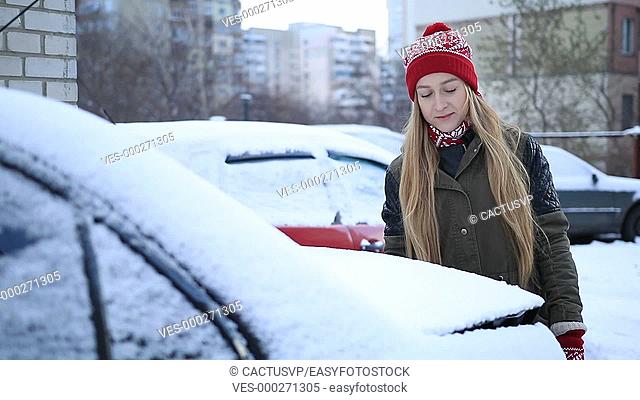 Cleaning car from snow every morning