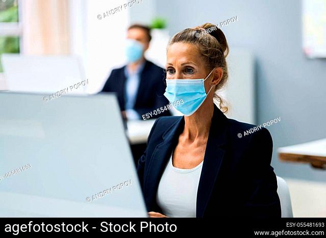 Business Team Training. Working On Computer With Face Mask