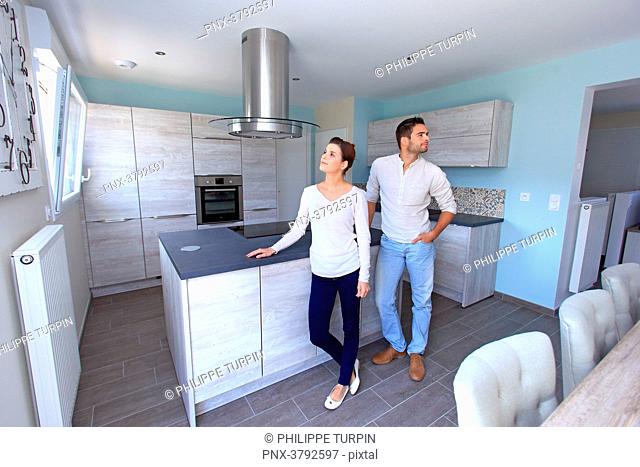 France, young couple in their new house
