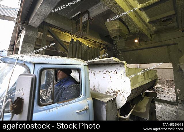 RUSSIA, ZAPOROZHYE REGION - DECEMBER 19, 2023: Loading concrete into a truck at a plant of reinforced concrete structures in the city of Berdyansk