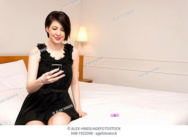 Pretty young woman waitng for date before a night out