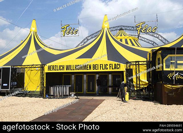 The yellow and black tent of the Flic Flac circus, exterior view, construction, preparations, and rehearsals at the Flic Flac circus