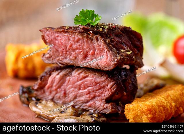 steak slices with croquettes and mushrooms