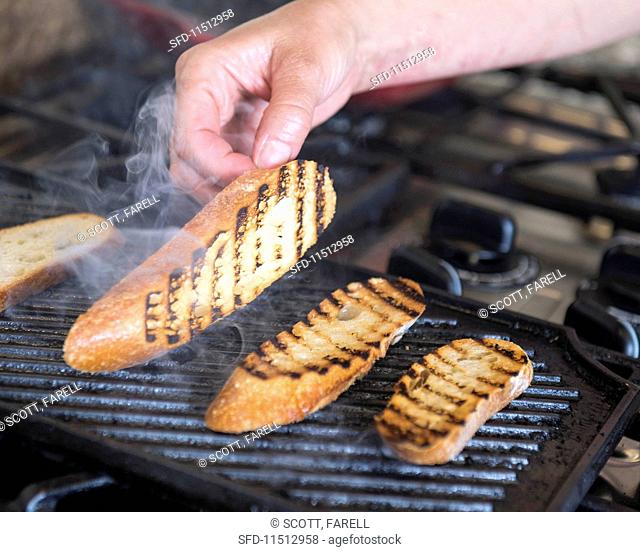 Bread being grilled