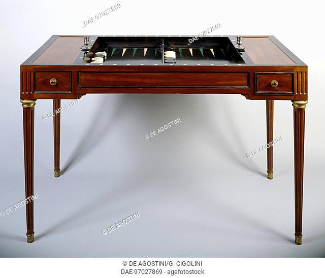Directoire style mahogany and bronze writing table or Tric Trac game table, ca 1820, with the top removed. France, 19th century.  Private Collection