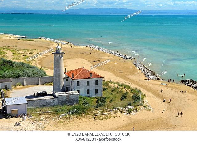 Aerial view of lighthouse of Bibione. In the background the coast of Friuli