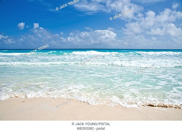 Gentle waves on a white tropical beach