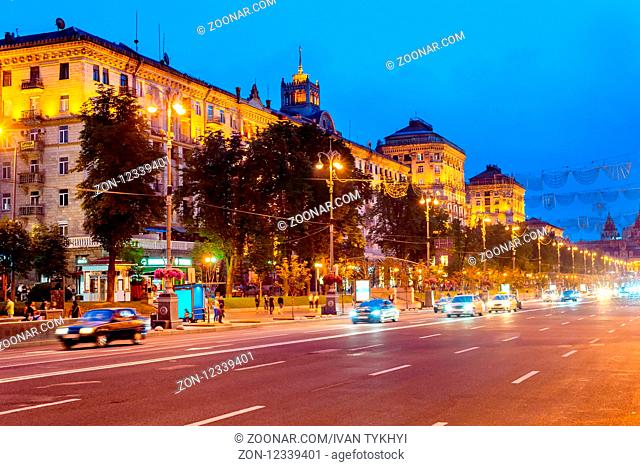 Evening cityscape with traffic on road of illuminated downtown Khreshchatyk street, Kiev, Ukraine