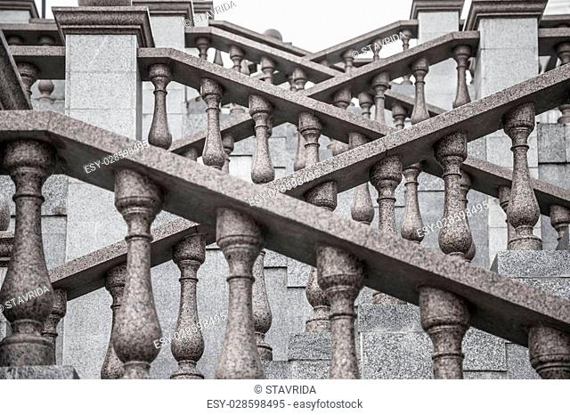 Detail of the granite staircase with beautiful carved balusters in classic style