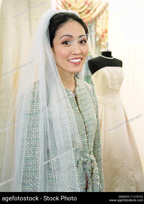 Young woman wearing a bridal veil
