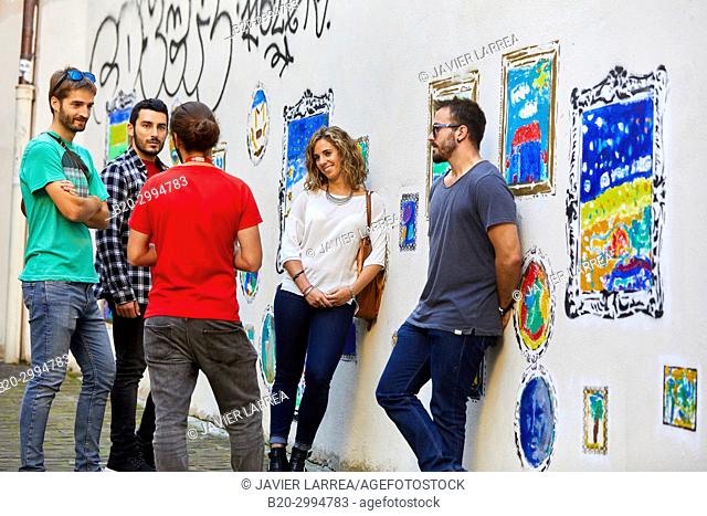 Group of tourists and guide making a tour of the city, Graffiti, Gaztelubide street, Donostia, San Sebastian, Gipuzkoa, Basque Country, Spain, Europe