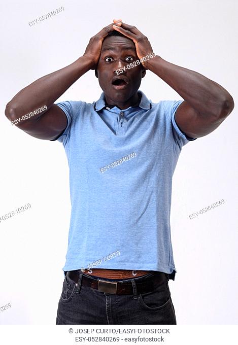 african man with expression of forgetfulness or surprise on white background