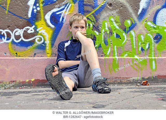 9-year-old boy, bored, football ground in Cologne, North Rhine-Westphalia, Germany, Europe