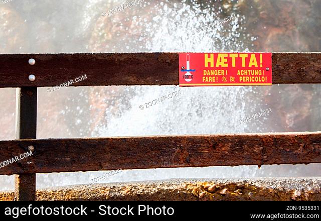 Danger - boiling watter sign. Boiling geothermal hot spring Deildartunguhver in Reykholtsdalur, Iceland