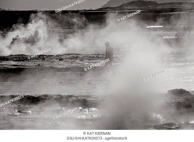 Man Walking Through Steam from Geyser, Iceland