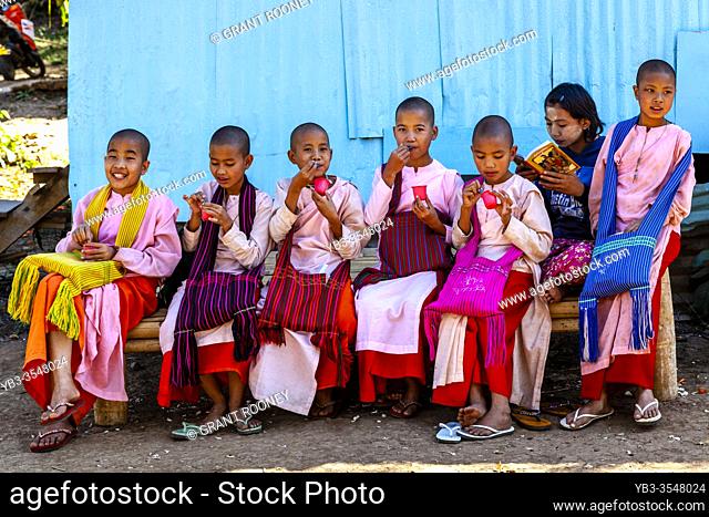 Young Thilashins Eating Ice Creams In Nyaung Shwe, Shan State, Myanmar