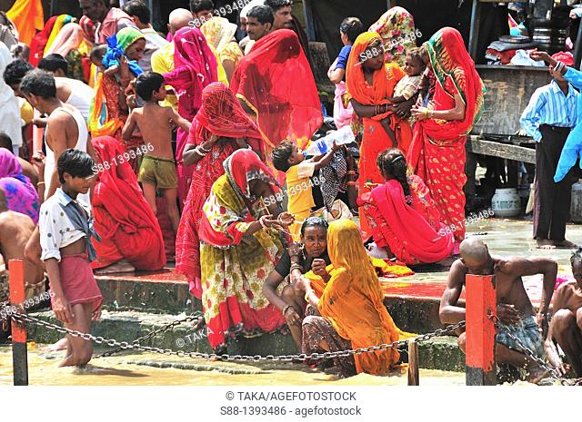 Pilgrims praying and bathing at Har Ki Pairi ghat by the Ganges River