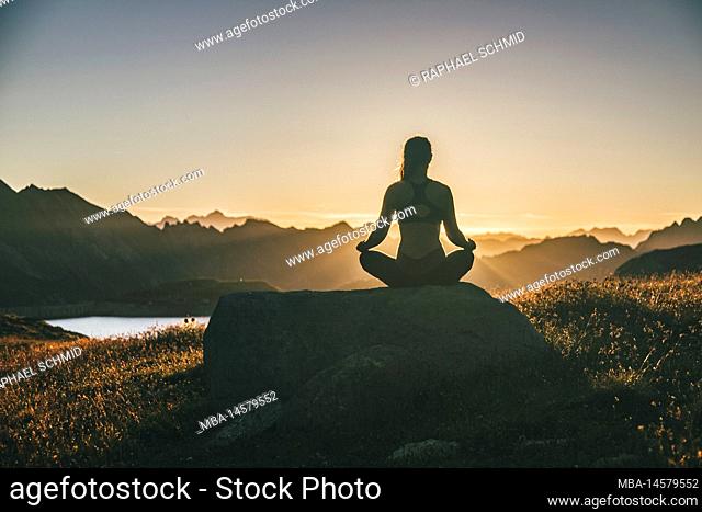 Yoga in the mountains, meditation at sunrise