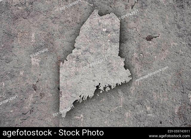 Map of Maine on weathered concrete