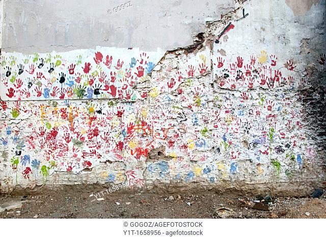 Wall with paintings of hands