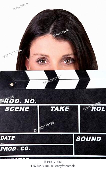 Woman holding movie clapper
