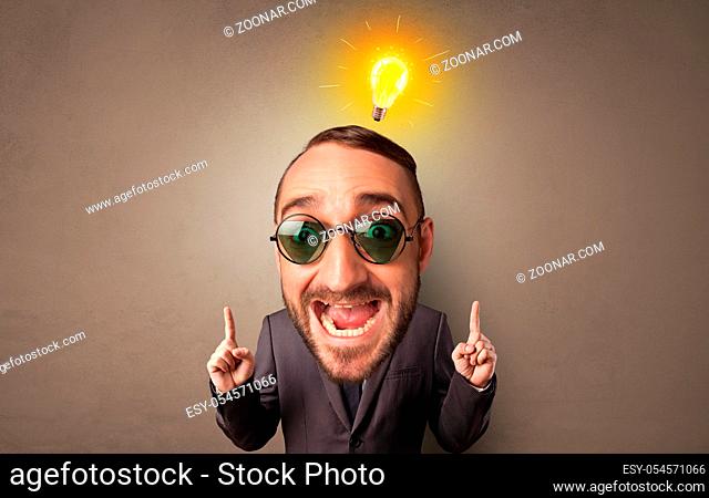 Funny person with big head with new idea concept and lighting bulb