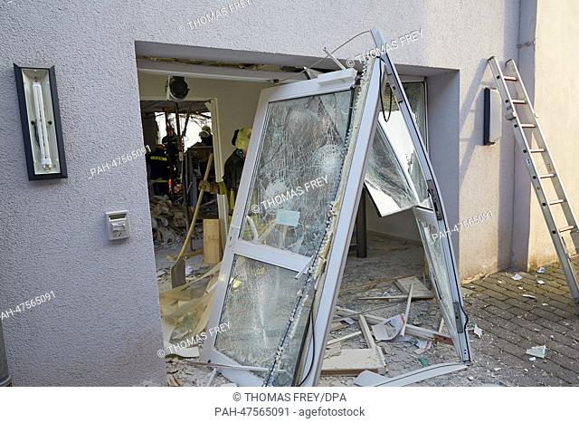 Emergency services secure the building of the bank Vols- und Raiffeisenbank, where an explosion took place inthe night, in Grosslittgen, Germany, 01 April 2014