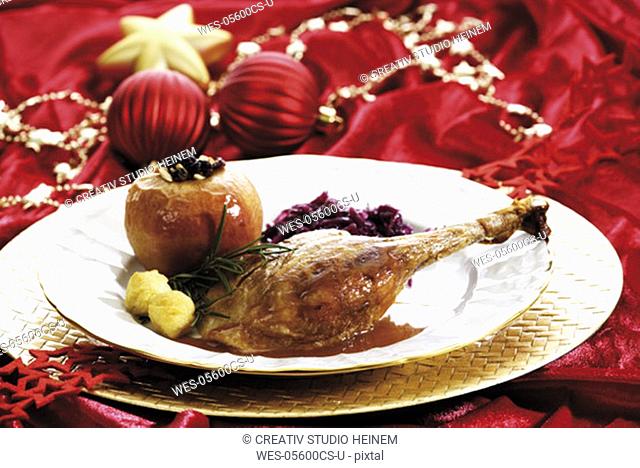 Roast goose with side dishes and christmas dekoration