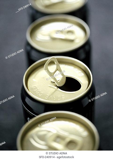 Beer cans, one opened