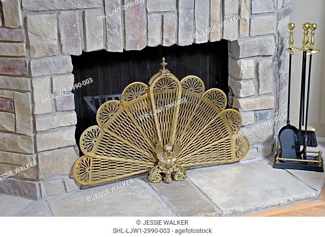 FIREPLACES: DETAIL brass fan firescreen, gas fire, simulated flagstone , fireplace tool set