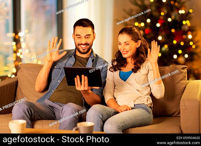 couple with tablet pc has video call on christmas
