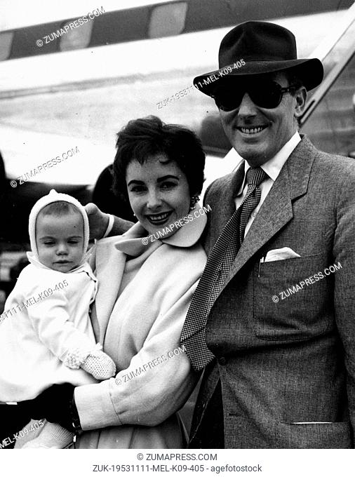 Oct. 10, 1953 - London, England, U.K. - Actress ELIZABETH TAYLOR with husband MICHAEL WILDING and their baby boy at the London Airport