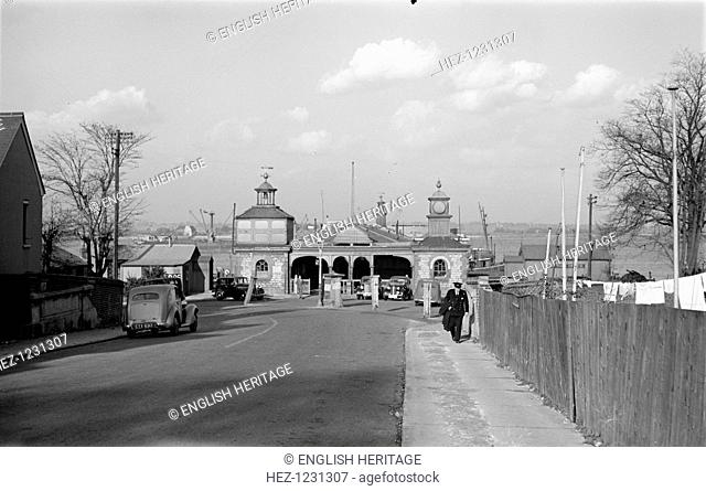 The entrance of Royal Terrace Pier, Gravesend, Kent, from Pier Road, c1945-c1965. The Pier was built in 1842-3. A man in uniform walks towards the camera